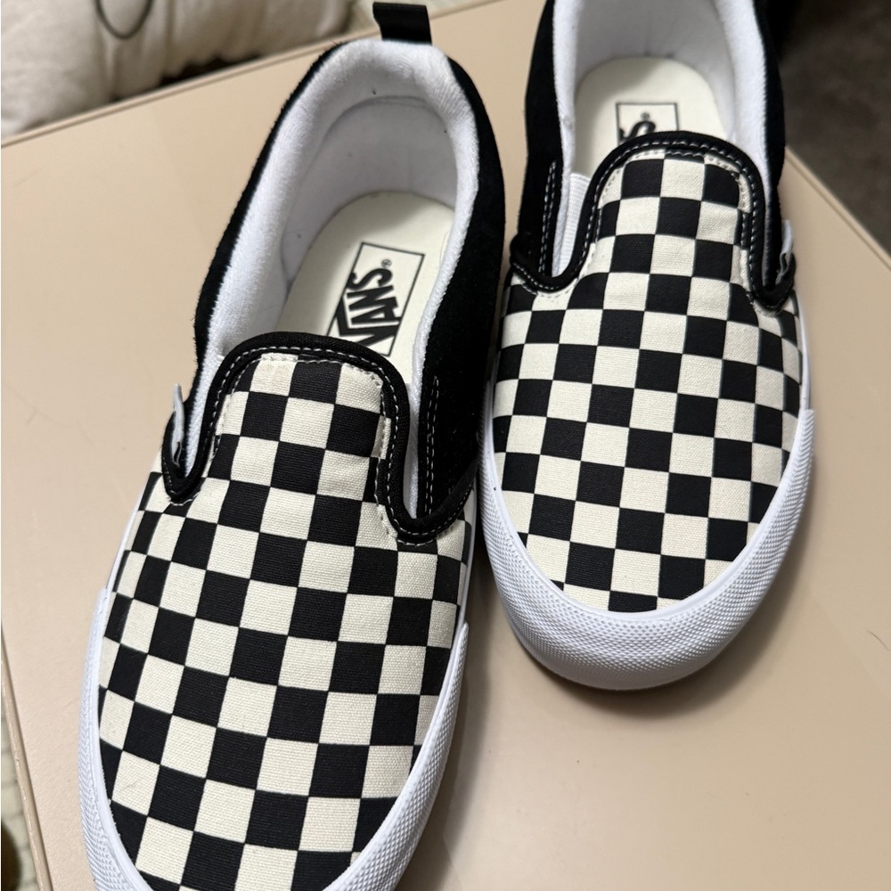 Vans Black and White Checkerboard Slip-On Sneakers